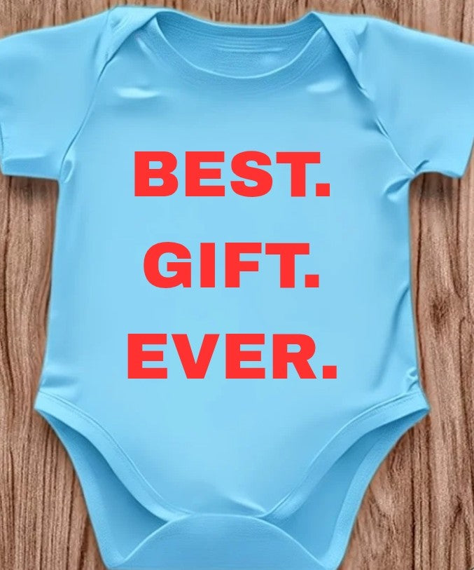 Funny baby onesie with the text 'Best.Gift.Ever.' on a wooden background